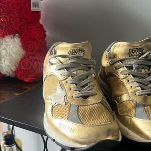 Golden Goose Gold and Silver Sneakers with Supportive Design